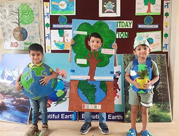 K.G. I children presenting an Earth Day project