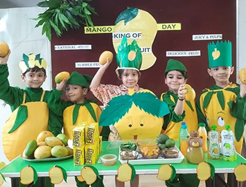 K.G. II children celebrating Mango Day